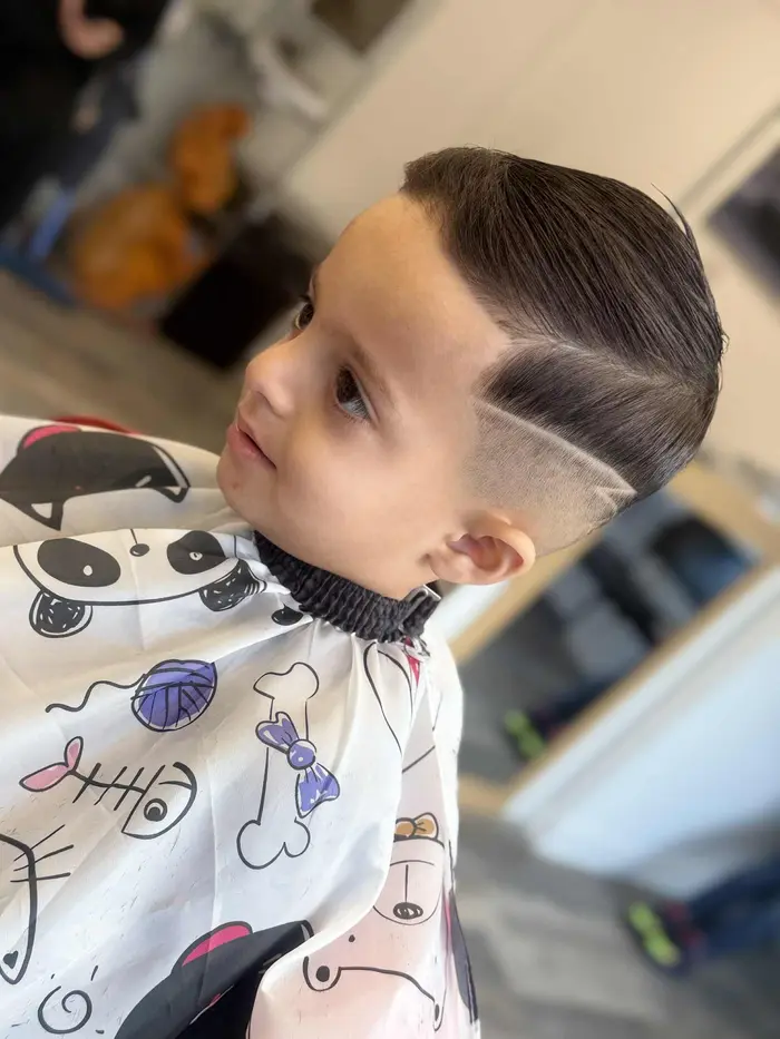 Boy's haircut with sharp hard part design
